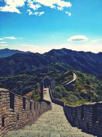 Scenic view of mountains against cloudy sky