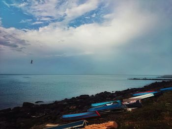 Scenic view of sea against cloudy sky