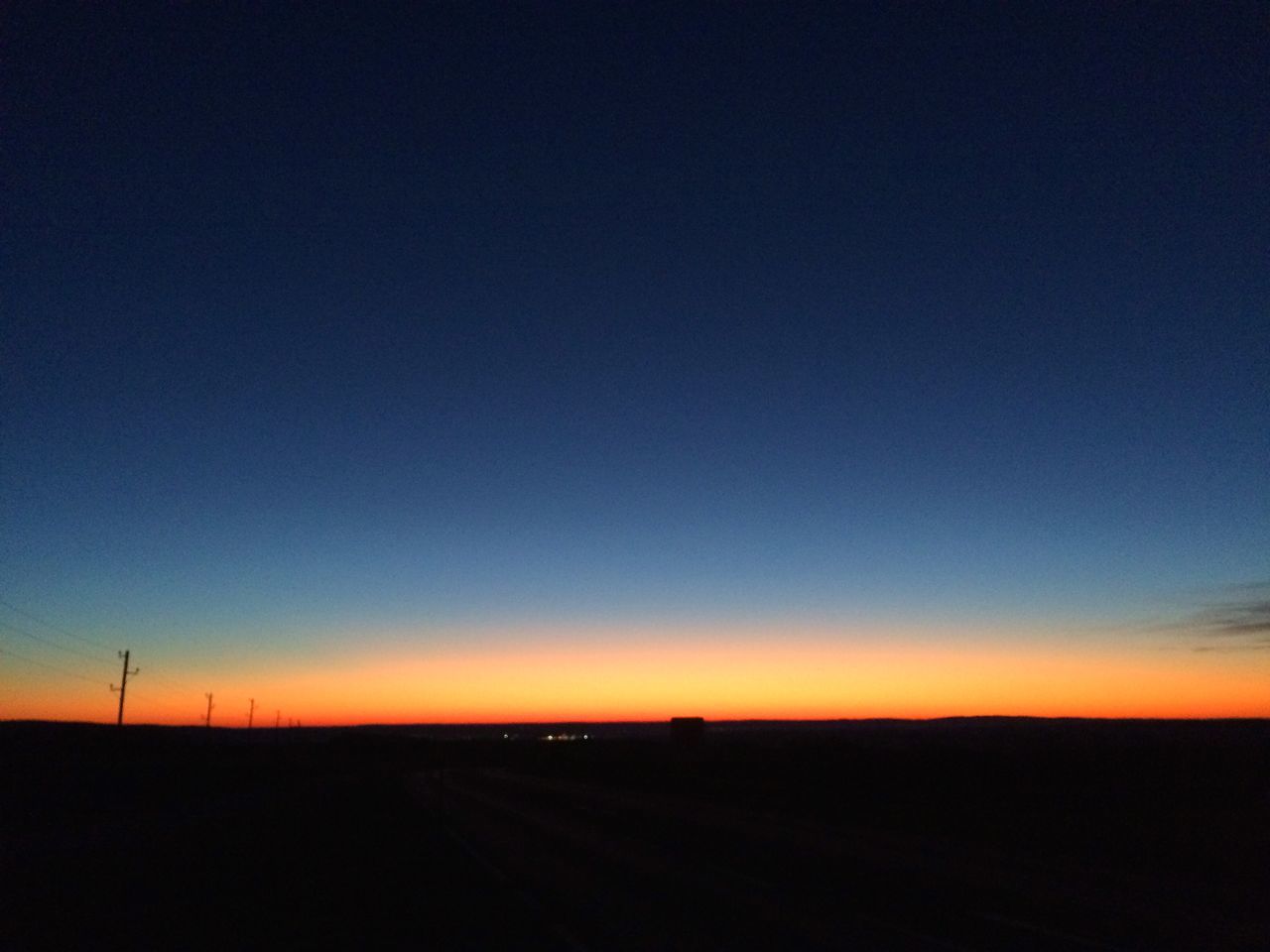 sunset, landscape, copy space, silhouette, tranquil scene, clear sky, tranquility, scenics, beauty in nature, orange color, road, field, nature, horizon over land, sky, dusk, transportation, idyllic, outdoors, blue