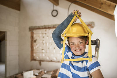 Portrait of smiling boy at home