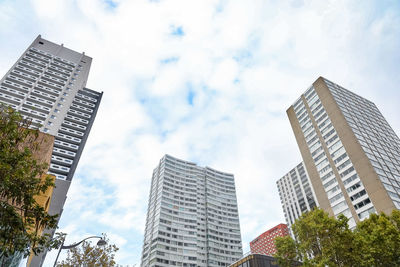 Low angle view of modern buildings against sky