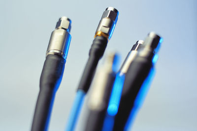 Close-up of colored pencils against blue background