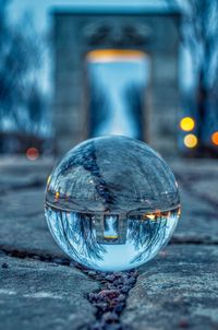 Close-up of crystal ball on glass