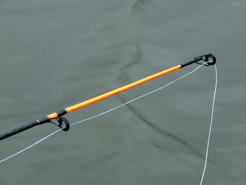 High angle view of fishing rod over lake