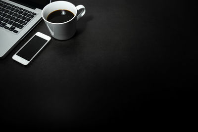 High angle view of coffee cup on table