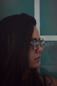 Close-up of woman wearing sunglasses outdoors