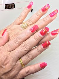 Close-up of woman hand with red hands