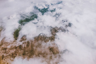 Scenic view of clouds over mountain against sky