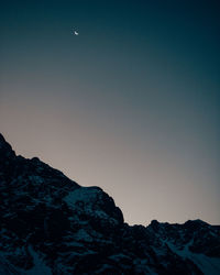 Moonrise over the snowy peaks in chile.