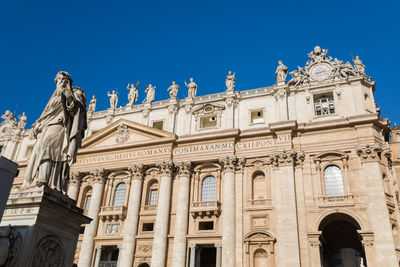 Low angle view of historical building against blue sky