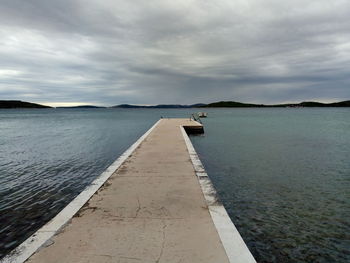 Pier over sea against sky