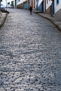 Surface level of cobblestone street in city