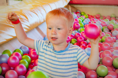 Portrait of cute boy with balloons