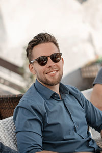 Smiling man wearing sunglasses
