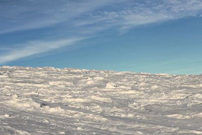 Scenic view of snowcapped mountain against blue sky