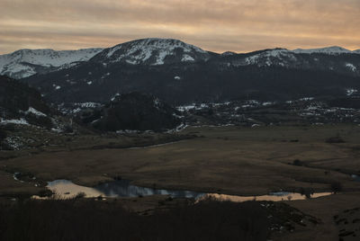 Scenic view of mountains against sky during winter