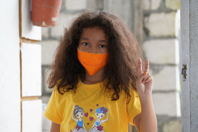 Portrait of teenage girl standing outdoors