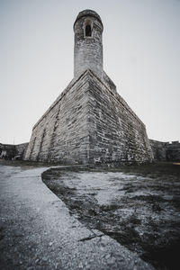 Low angle view of old building against sky