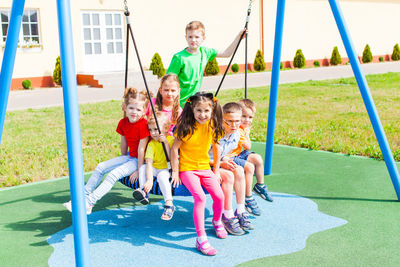 Portrait of happy girl playing on playground