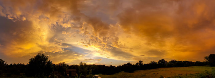 Scenic view of dramatic sky during sunset