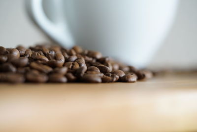 Close-up of coffee beans on table