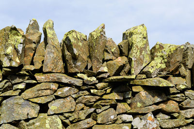 Stone wall against sky