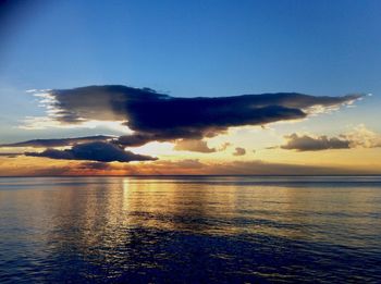 Scenic view of sea against sky at sunset