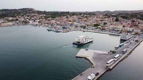 Photos of the kefalonia island  greece  display the lixouri region and an arriving bus ship