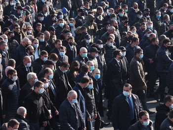 High angle view of people walking on street in city