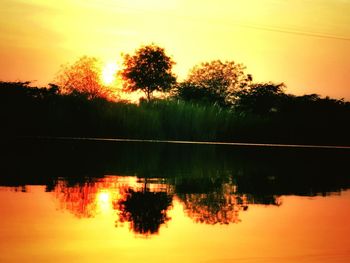 Scenic view of sunset over lake