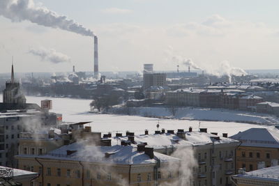 High angle view of buildings in city against sky