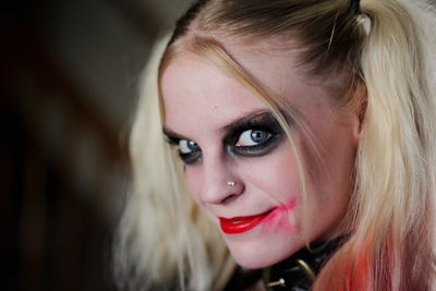 Portrait of happy woman with make-up at home