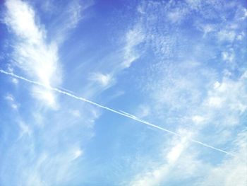 Low angle view of vapor trails in sky