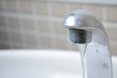 Close-up of water flowing from faucet