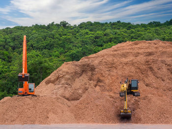 Construction site on field against sky