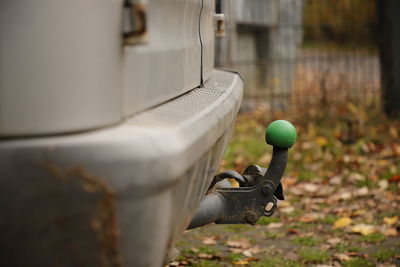 Close-up of bicycle on metal railing