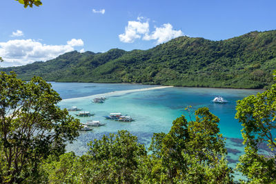 High angle view of sea by mountains