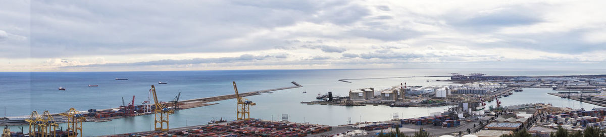 High angle view of harbor by sea against sky