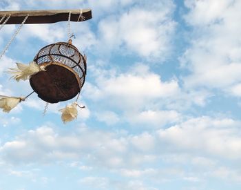 Low angle view of hanging against sky