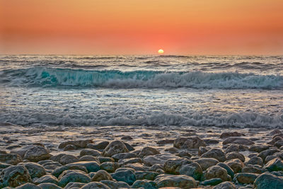 Scenic view of sea against sky during sunset