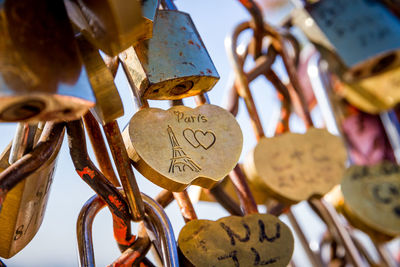 Close-up of padlocks hanging on metal