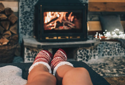 Low section of woman relaxing at home