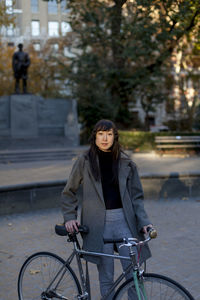 Portrait of a young woman in an urban park