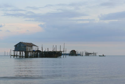 Scenic view of sea and buildings against sky