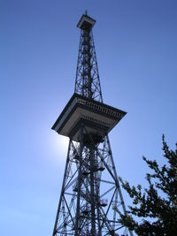 Low angle view of tower against blue sky