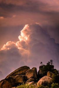 Low angle view of rocks against sky during sunset