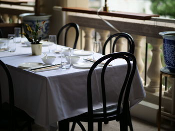 Empty chairs and table in cafe