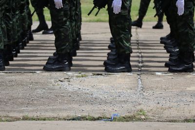 Low section of soldiers standing on street