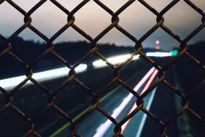 Full frame shot of chainlink fence against sky