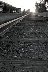 Surface level of railroad tracks against sky